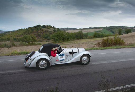 CAGLI , ITALY - OTT 24 - 2020 : BMW 328 on an old racing car in rally Mille Miglia 2020 the famous italian historical race (1927-1957)