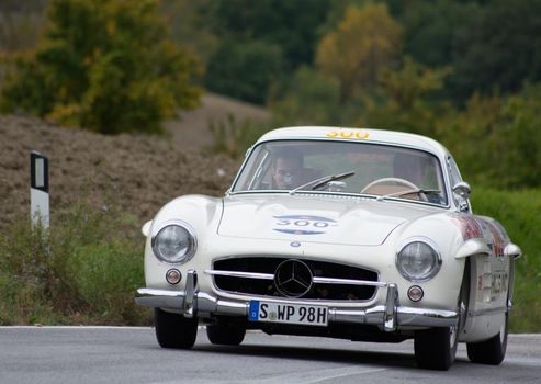 CAGLI , ITALY - OTT 24 - 2020 : MERCEDES 300 SL on an old racing car in rally Mille Miglia 2020 the famous italian historical race (1927-1957)