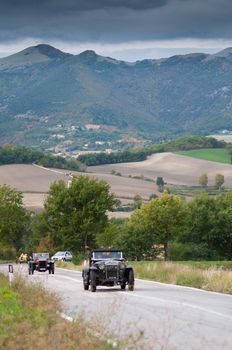 CAGLI , ITALY - OTT 24 - 2020 : OM 665 SUPERBA on an old racing car in rally Mille Miglia 2020 the famous italian historical race (1927-1957)