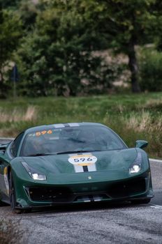 CAGLI , ITALY - OTT 24 - 2020 : FERRARI 488 PISTA on an old racing car in rally Mille Miglia 2020 the famous italian historical race (1927-1957)