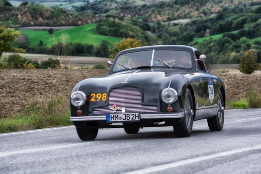 CAGLI , ITALY - OTT 24 - 2020 : ASTON MARTIN DB 2 VINTAGE on an old racing car in rally Mille Miglia 2020 the famous italian historical race (1927-1957)