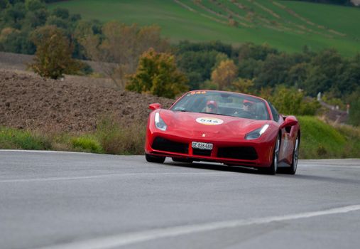 CAGLI , ITALY - OTT 24 - 2020 : FERRARI 488 SPIDER on an old racing car in rally Mille Miglia