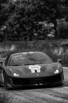 CAGLI , ITALY - OTT 24 - 2020 : FERRARI 488 PISTA on an old racing car in rally Mille Miglia 2020 the famous italian historical race (1927-1957)