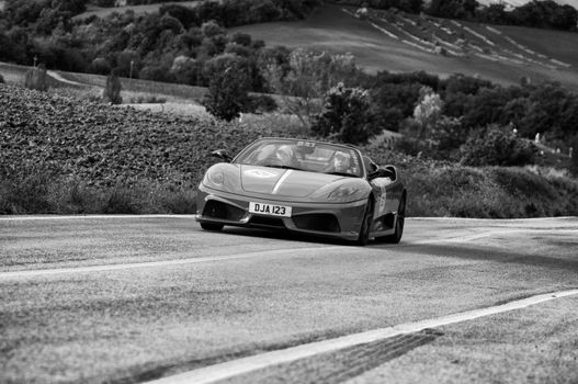 CAGLI , ITALY - OTT 24 - 2020 : FERRARI SCUDERIA SPIDER 16M on an old racing car in rally Mille Miglia 2020 the famous italian historical race (1927-1957)