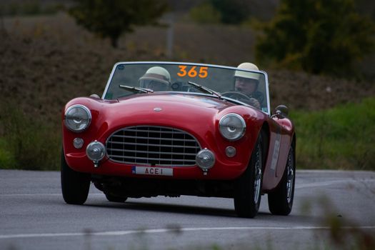 CAGLI , ITALY - OTT 24 - 2020 : AC ACE 1956 on an old racing car in rally Mille Miglia 2020 the famous italian historical race (1927-1957