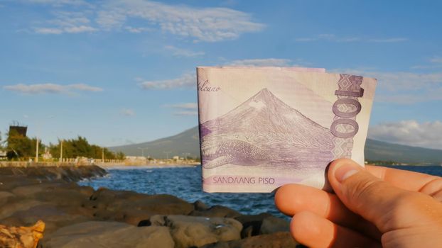 Philippine money. A Filipino monetary note in one hundred pesos is dedicated to the Mayon volcano