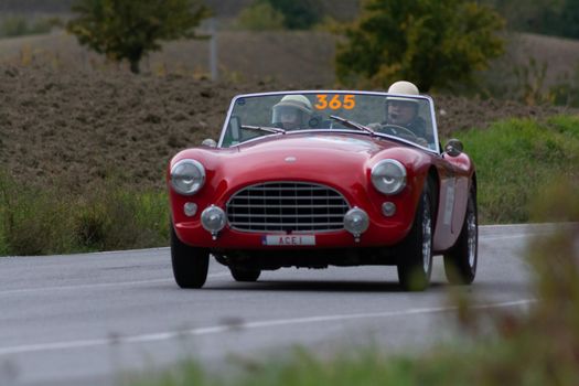 CAGLI , ITALY - OTT 24 - 2020 : AC ACE 1956 on an old racing car in rally Mille Miglia 2020 the famous italian historical race (1927-1957