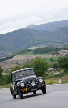 CAGLI , ITALY - OTT 24 - 2020 : FIAT 500 C on an old racing car in rally Mille Miglia 2020 the famous italian historical race (1927-1957)