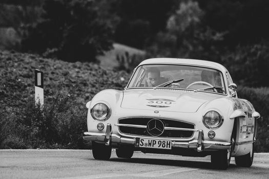 CAGLI , ITALY - OTT 24 - 2020 : MERCEDES-BENZ 300 SL W 198 1954 on an old racing car in rally Mille Miglia 2020 the famous italian historical race (1927-1957)