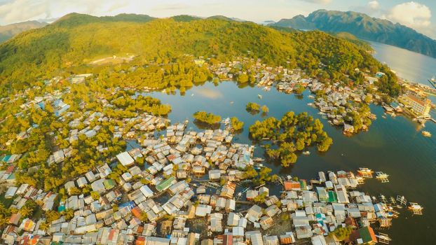 Aerial view Coron city with slums and poor district. Palawan. Busuanga island. Evening time and sunset. Fisheye view