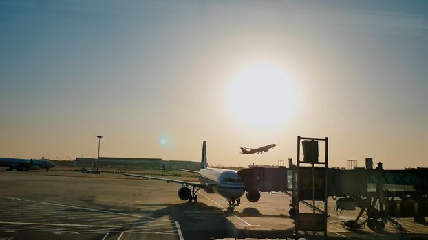 The plane leaves for the runway for the flight. Evening at sunset. Beijing. China