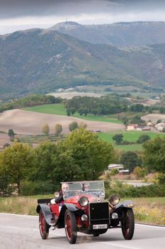 CAGLI , ITALY - OTT 24 - 2020 : LANCIA LAMBA SPIDER CABRIO on an old racing car in rally Mille Miglia 2020 the famous italian historical race (1927-1957)