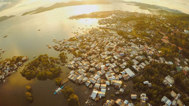 Aerial view Coron city with slums and poor district. Palawan. Busuanga island. Evening time and sunset. Fisheye view