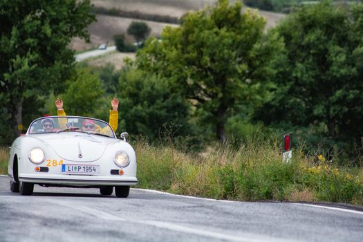 CAGLI , ITALY - OTT 24 - 2020 : PORSCHE 356 SPEEDSTER on an old racing car in rally Mille Miglia 2020 the famous italian historical race (1927-1957)
