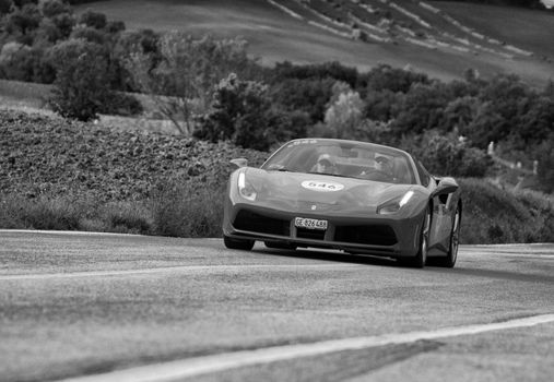 CAGLI , ITALY - OTT 24 - 2020 : FERRARI 488 SPIDER on an old racing car in rally Mille Miglia