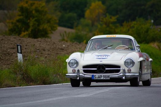 CAGLI , ITALY - OTT 24 - 2020 : MERCEDES-BENZ 300 SL W 198 1954 on an old racing car in rally Mille Miglia 2020 the famous italian historical race (1927-1957)