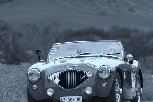 CAGLI , ITALY - OTT 24 - 2020 : AUSTIN HEALEY 100/4 BN2 1956 on an old racing car in rally Mille Miglia 2020 the famous italian historical race (1927-1957)