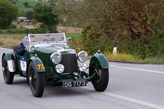 CAGLI , ITALY - OTT 24 - 2020 : ASTON MARTIN LE MANS on an old racing car in rally Mille Miglia 2020 the famous italian historical race (1927-1957)