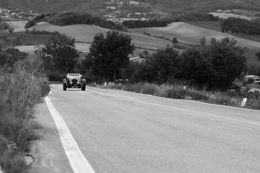 CAGLI , ITALY - OTT 24 - 2020 : ASTON MARTIN LE MANS on an old racing car in rally Mille Miglia 2020 the famous italian historical race (1927-1957)