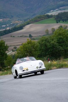 CAGLI , ITALY - OTT 24 - 2020 : PORSCHE 356 SPEEDSTER 1500 1955 on an old racing car in rally Mille Miglia 2020 the famous italian historical race (1927-1957)