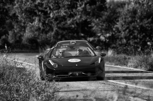 CAGLI , ITALY - OTT 24 - 2020 : FERRARI 458 SPIDER on an old racing car in rally Mille Miglia 2020 the famous italian historical race (1927-1957)