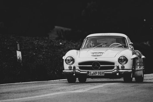 CAGLI , ITALY - OTT 24 - 2020 : MERCEDES-BENZ 300 SL W 198 1954 on an old racing car in rally Mille Miglia 2020 the famous italian historical race (1927-1957)