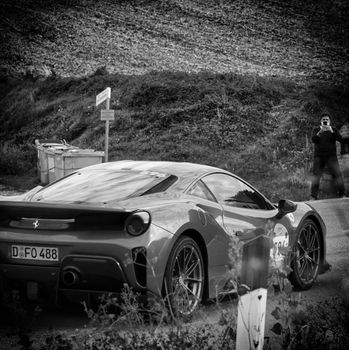 CAGLI , ITALY - OTT 24 - 2020 : FERRARI 488 PISTA on an old racing car in rally Mille Miglia 2020 the famous italian historical race (1927-1957)