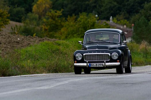 CAGLI , ITALY - OTT 24 - 2020 : volvo on an old racing car in rally Mille Miglia 2020 the famous italian historical race (1927-1957)