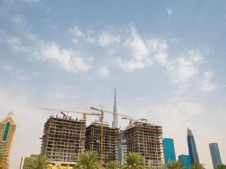 Construction of a new skyscraper in the background of the city center of Dubai
