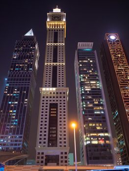 Night view of Dubai Downtown with skyscrapers