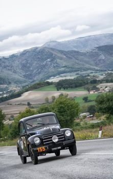 CAGLI , ITALY - OTT 24 - 2020 : FIAT 500 C on an old racing car in rally Mille Miglia 2020 the famous italian historical race (1927-1957)