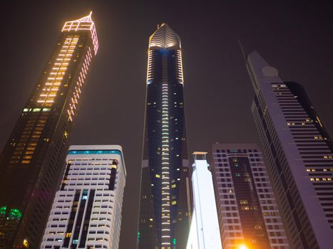 Night view of Dubai Downtown with skyscrapers