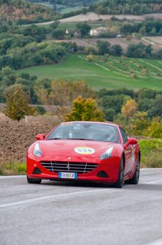 CAGLI , ITALY - OTT 24 - 2020 : CALIFORNIA T 2015 on an old racing car in rally Mille Miglia 2020 the famous italian historical race (1927-1957)