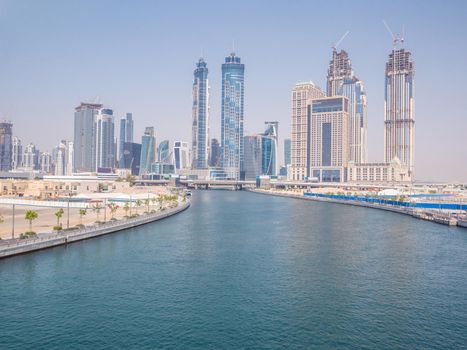 Panorama of the city of Dubai from the bridge of the river channel Dubai Creek.