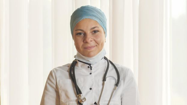 Portrait of a young female doctor in a mask