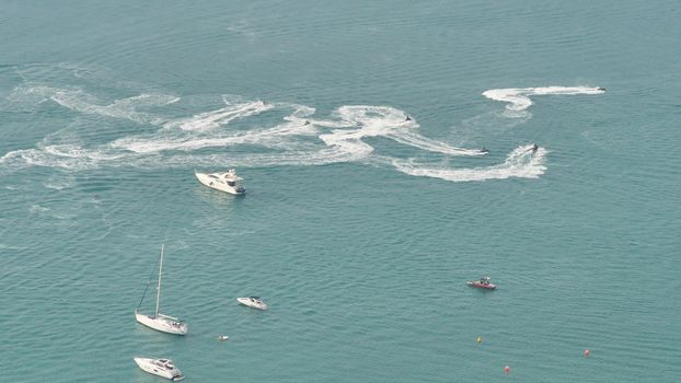 Boats swim and leave trails around Dubai
