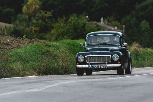 CAGLI , ITALY - OTT 24 - 2020 : volvo on an old racing car in rally Mille Miglia 2020 the famous italian historical race (1927-1957)