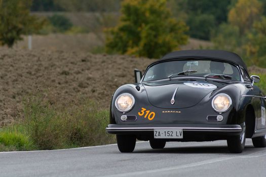 CAGLI , ITALY - OTT 24 - 2020 : PORSCHE 356 SPEEDSTER CARRERA 1500 GS 1955 on an old racing car in rally Mille Miglia 2020 the famous italian historical race (1927-1957)