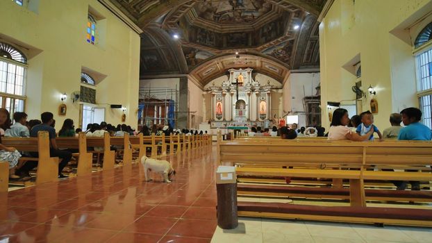 Anda, Philippines - January 5, 2018: Believers before the Mass in the Catholic Church. And