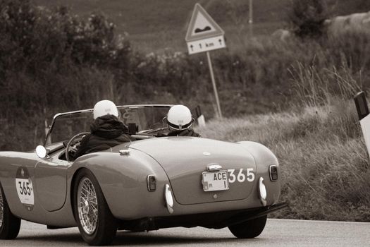 CAGLI , ITALY - OTT 24 - 2020 : AC ACE 1956 on an old racing car in rally Mille Miglia 2020 the famous italian historical race (1927-1957