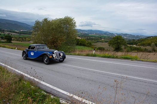 CAGLI , ITALY - OTT 24 - 2020 : LANCIA ASTURA 1938 on an old racing car in rally Mille Miglia 2020 the famous italian historical race (1927-1957