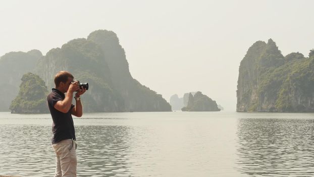 Photographer photographing the nature of Ha Long Bay