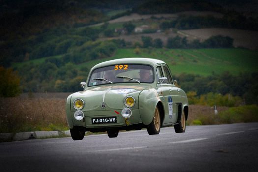 CAGLI , ITALY - OTT 24 - 2020 : RENAULT DAUPHINE 1957 on an old racing car in rally Mille Miglia 2020 the famous italian historical race (1927-1957