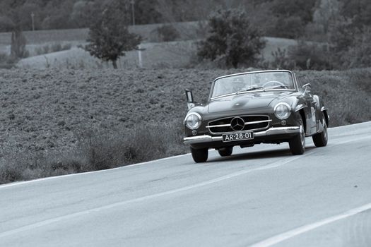 CAGLI , ITALY - OTT 24 - 2020 : MERCEDES-BENZ 190 SL 1955 on an old racing car in rally Mille Miglia 2020 the famous italian historical race (1927-1957