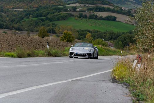 CAGLI , ITALY - OTT 24 - 2020 : porsche 911 speedster on an old racing car in rally Mille Miglia 2020 the famous italian historical race (1927-1957