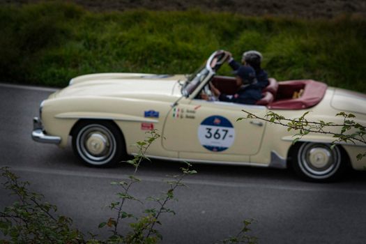 CAGLI , ITALY - OTT 24 - 2020 : MERCEDES-BENZ 190 SL 1956 on an old racing car in rally Mille Miglia 2020 the famous italian historical race (1927-1957