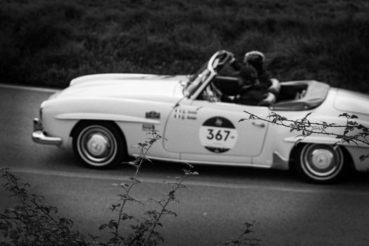 CAGLI , ITALY - OTT 24 - 2020 : MERCEDES-BENZ 190 SL 1956 on an old racing car in rally Mille Miglia 2020 the famous italian historical race (1927-1957