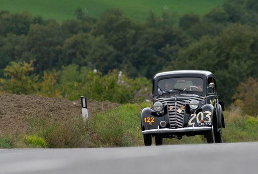 CAGLI , ITALY - OTT 24 - 2020 : FIAT 1099 MUSONE 1947 on an old racing car in rally Mille Miglia 2020 the famous italian historical race (1927-1957)