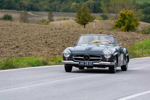 CAGLI , ITALY - OTT 24 - 2020 : MERCEDES-BENZ 190 SL 1955 on an old racing car in rally Mille Miglia 2020 the famous italian historical race (1927-1957