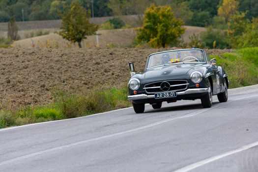 CAGLI , ITALY - OTT 24 - 2020 : MERCEDES-BENZ 190 SL 1955 on an old racing car in rally Mille Miglia 2020 the famous italian historical race (1927-1957